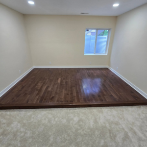 A room featuring new hardwood and carpet flooring installed by Supreme Home Improvements in Channahon, IL