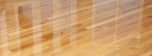 A close-up view of a newly installed, shiny hardwood floor by Shore Flooring Solutions in Edison, NJ.