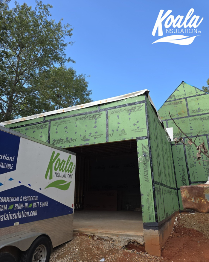 A new home construction site with a Koala Insulation trailer in Baton Rouge, LA.