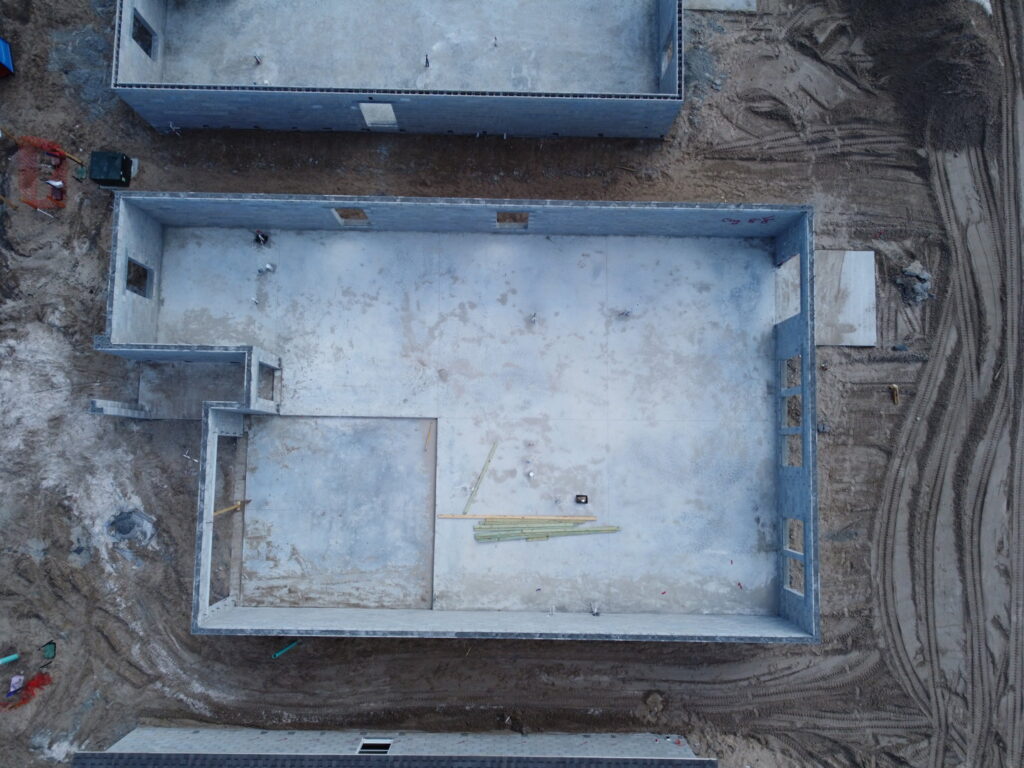 Aerial view of a new home foundation under construction by Beyond Builders in Tampa, FL