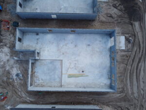 Aerial view of a new home foundation under construction by Beyond Builders in Tampa, FL