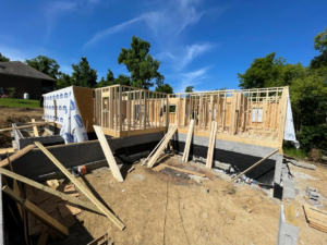 New home construction showing foundation and wall framing by Cord Construction in Winchester, KY