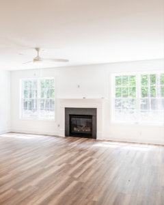 A newly constructed living room with a modern fireplace by Pigliavento Associates, LLC, general contractors in Schenectady, NY.