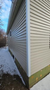 Newly installed house siding and corner trim by Clausen Construction LLC in Williston, ND