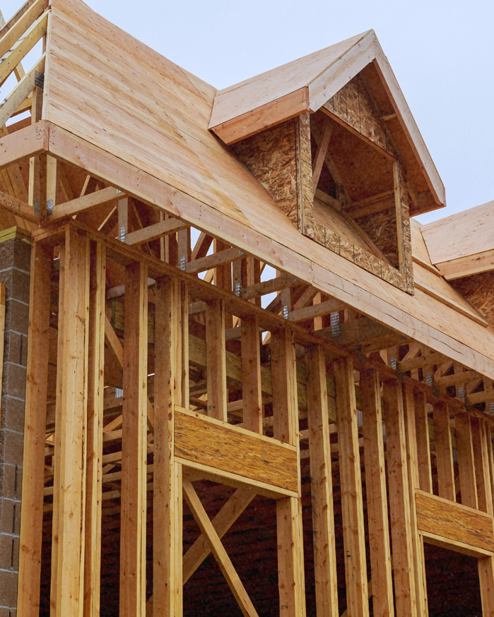 The sturdy wooden framing of a new house under construction by Pjai Projects in Nashville, TN