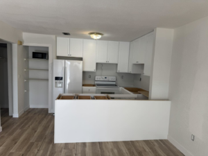New white kitchen cabinets and appliances installed in a home under construction by Bradford Brothers Builders Inc. in Cape Coral, FL