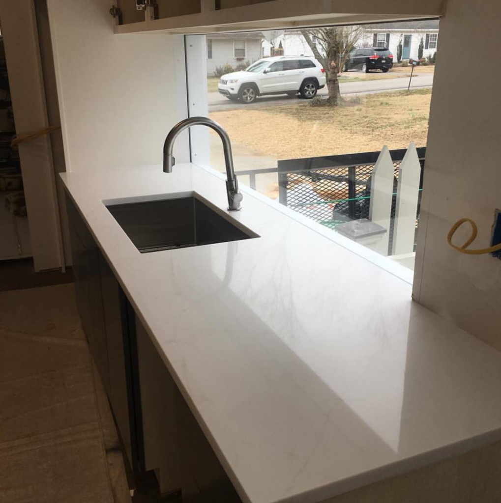 Newly installed kitchen countertop with a modern sink and faucet by The Womack Group / Home Service Plus, LLC in Franklin, TN