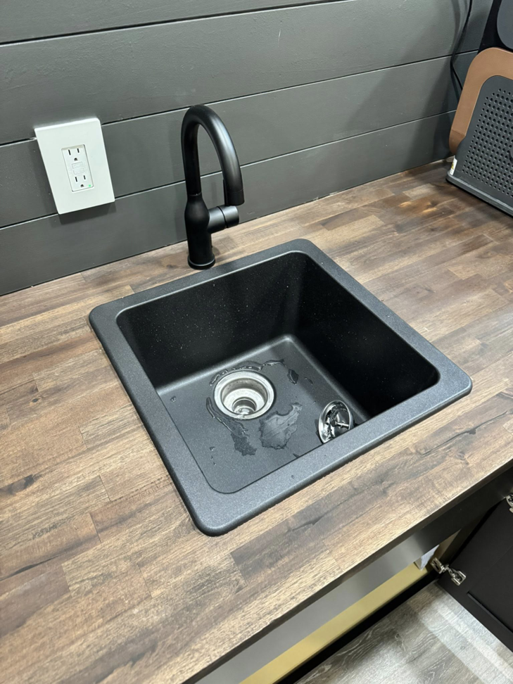 Newly installed black kitchen sink and faucet by Landsaw Craftsman & Co. in Richmond, KY.
