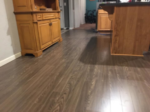 A kitchen featuring newly installed laminate flooring, completed by MSL Construction in Salem, OR