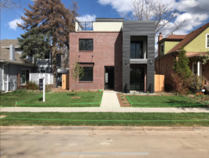 New lawn and tree planting at the front of a modern house by GKC Landscaping Contractors in Thornton, CO.