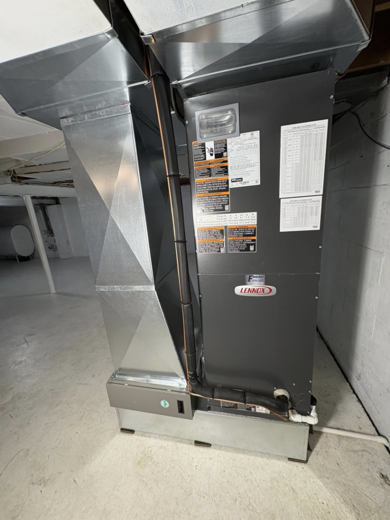 A new Lennox furnace and air handler unit installed in a basement by Fletchers Plumbing and Heating in Smyrna, DE