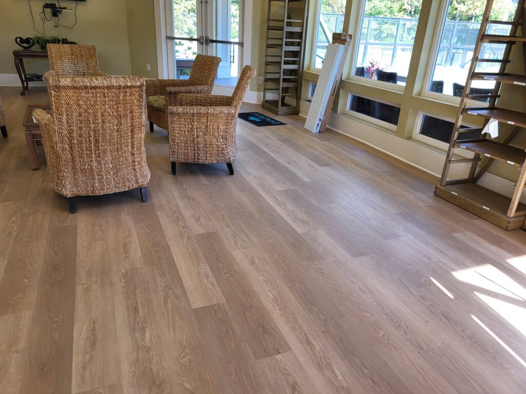 New LVP flooring installation in a room by Gladiator Flooring LLC, a handyman service in Summerville, SC.