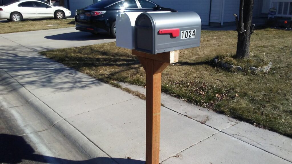 A newly installed mailbox on a wooden post by Bearded Hammer LLC in Meridian, ID.