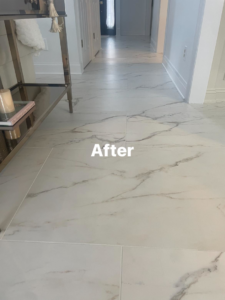 Newly installed white marble-look tile flooring in a hallway by Ray's construction in St. George, UT.