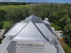 An aerial view of a newly installed metal roof by American Custom Exteriors in North Charleston, SC.
