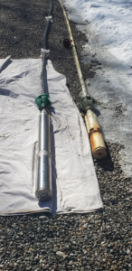 New and old well pumps laid out for replacement by Advanced Rooter Plumbing in Norwalk, CT