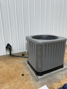 A newly installed outdoor HVAC condenser unit by ThermaPros in Leesburg, FL.