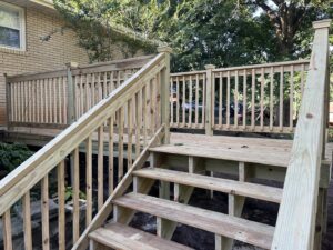 A newly constructed outdoor wooden deck with sturdy stairs, built by Hill Renovations LLC in Athens, GA