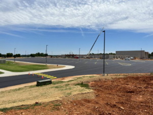 Fresh yellow pavement markings on a new commercial parking lot project by Marine One Striping in Clarksville, TN.