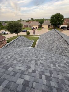 Aerial view of a newly installed residential roof, showcasing quality work by MDN Roofing 2 Flooring LLC in Fort Worth, TX.