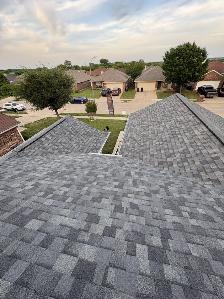 Aerial view of a newly installed residential roof, showcasing quality work by MDN Roofing 2 Flooring LLC in Fort Worth, TX.