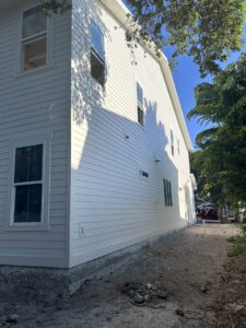 New residential siding installation on the side of a home by M&J Florida Enterprise Llc, a general contractor in Orlando, FL.