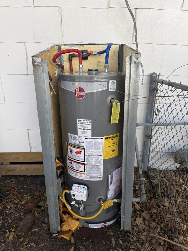 A newly installed Rheem outdoor water heater with plumbing connections by High Tide Home Remodeling in Charleston, SC.