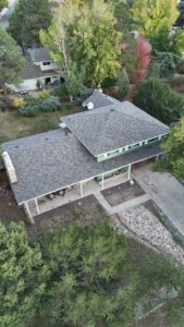 Aerial view of a house with a newly installed roof by Premium Home Solutions LLC in Hickory Hills, IL
