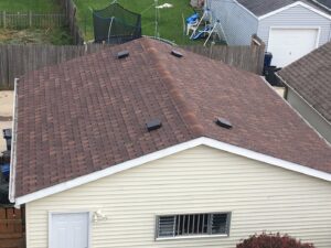 New roof shingle installation with vents on a residential home by Top Notch Contracting in Racine, WI.