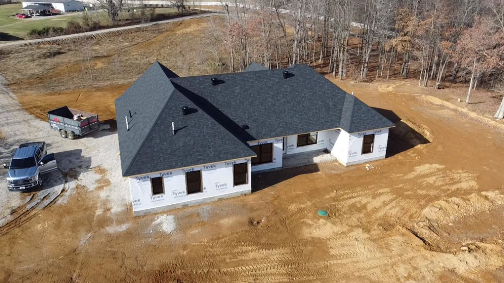 An aerial view of a new shingle roof installation on a house under construction by SJL Contracting, LLC in Owensboro, KY.