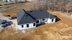 An aerial view of a new shingle roof installation on a house under construction by SJL Contracting, LLC in Owensboro, KY.