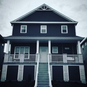 The exterior of a house with new siding and seamless gutters installed by Gutter Flow7 LLC in Madison, WI.