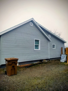 Newly installed gray siding and vents on a house exterior by Investment Handyman Services in Pocatello, ID