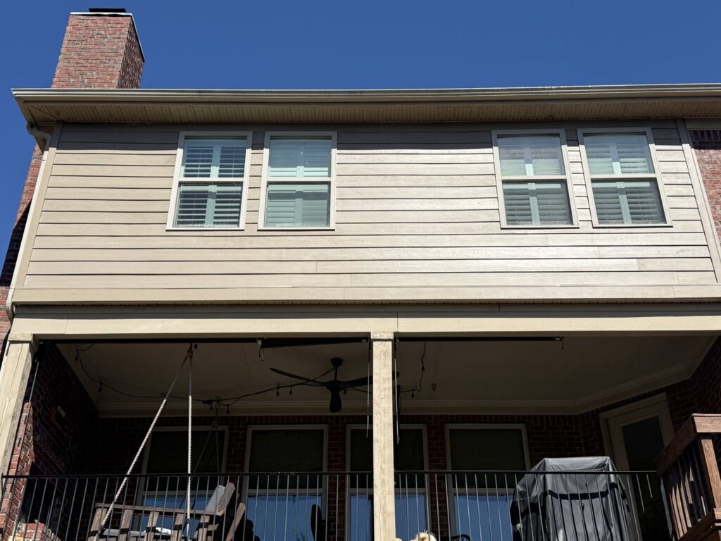 Freshly installed siding on a house with a covered patio, completed by Music City Exteriors in Nashville, TN