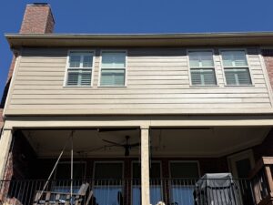 Freshly installed siding on a house with a covered patio, completed by Music City Exteriors in Nashville, TN