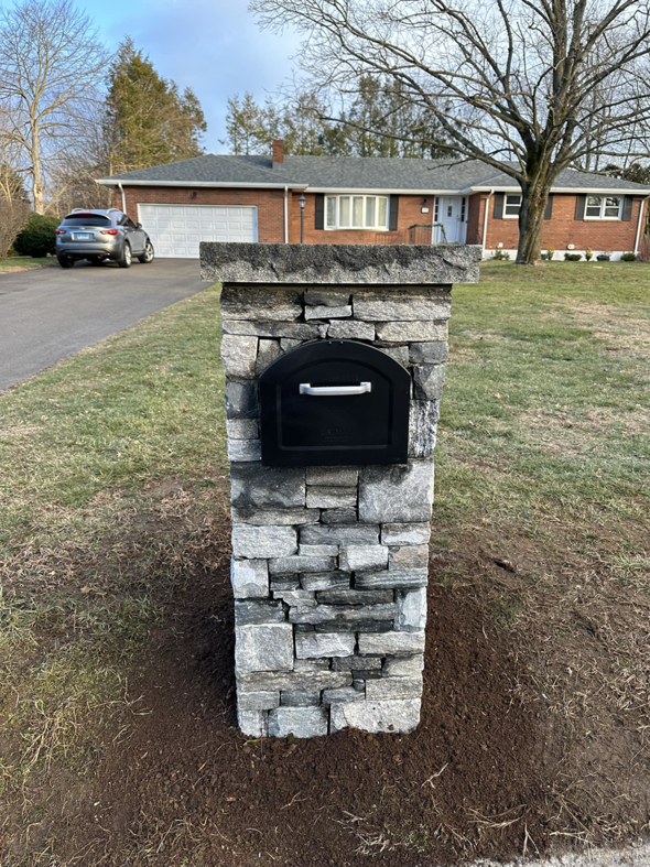 A new stone mailbox post installed by Tomori's masonry llc in Cheshire, CT