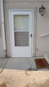 New white storm door installation completed by Shane's Handyman Service in Edmond, OK.