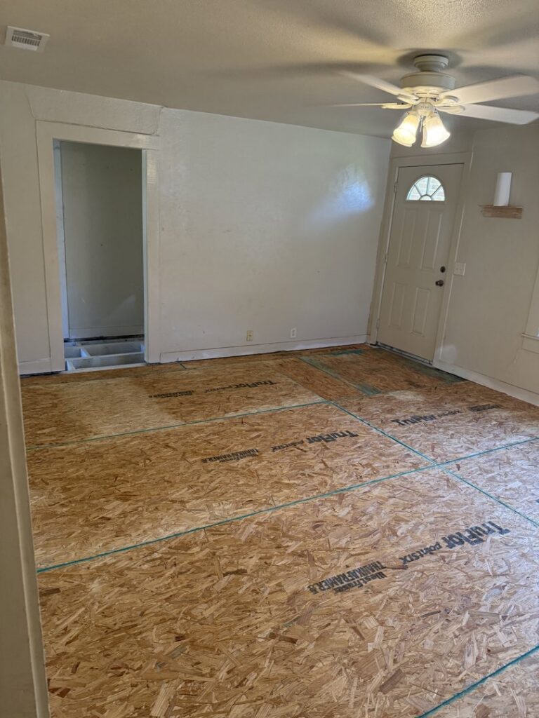 A room with new subfloor installed, ready for final flooring, by Coyote Restoration in North Richland Hills, TX.