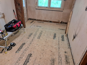A room undergoing renovation with new subflooring installed by Vest Home Services LLC in Greenville, SC.