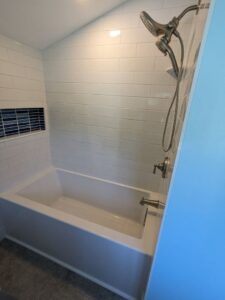 Newly tiled shower and bathtub installation by MB&E Home Improvement in Augusta, ME.