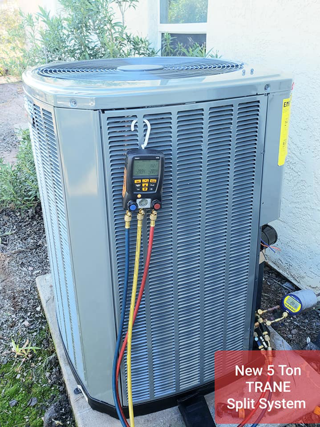 A new Trane indoor air handler unit being installed by Rehabbing CASAS in Phoenix, AZ