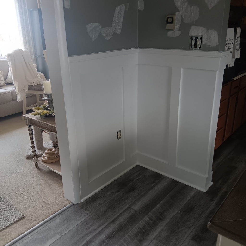 Newly installed and painted white wainscoting and trim in a corner by Carter's painting in Martinsburg, WV.