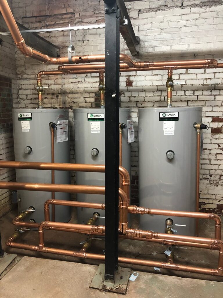 New water heater installation with intricate copper piping by JF Plumbing & Heating in Rockville, MD.