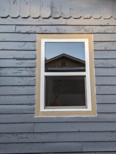 Exterior view of a newly installed window on a house by Friendly Handyman LLC in Wichita, KS