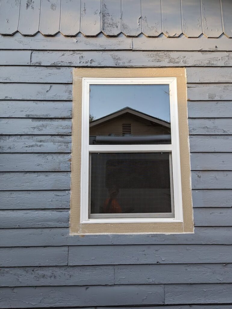 Exterior view of a newly installed window on a house by Friendly Handyman LLC in Wichita, KS
