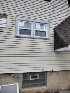 Exterior of a house showing new window installation by I.B. Remodeling LLC in Dayton, OH.
