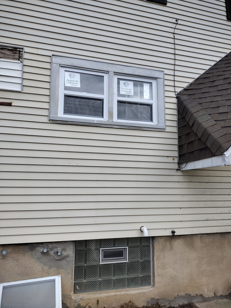Exterior of a house showing new window installation by I.B. Remodeling LLC in Dayton, OH.