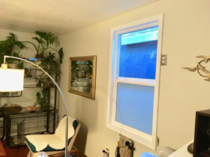 A newly installed window in an interior room, showcasing work by J.V. Repairs in Sacramento, CA.