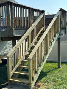 A newly constructed wooden deck staircase, built by Enjaycee Unlimited in Cincinnati, OH.