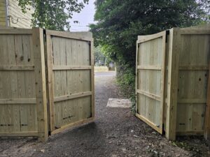 New wooden fence gate installation by A Man Who Can LLC, providing quality handyman services in Milford, DE.